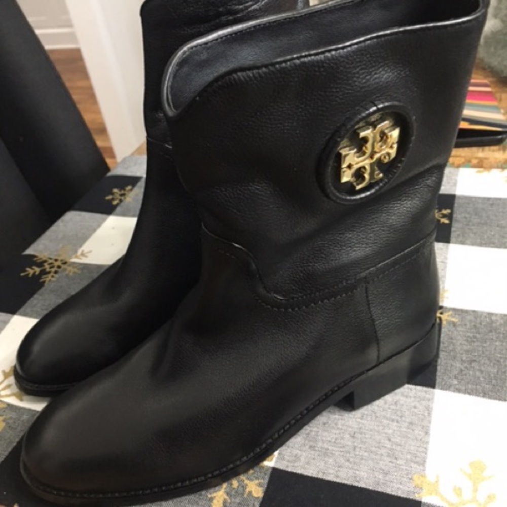 Women’s black Tory Burch booties.
